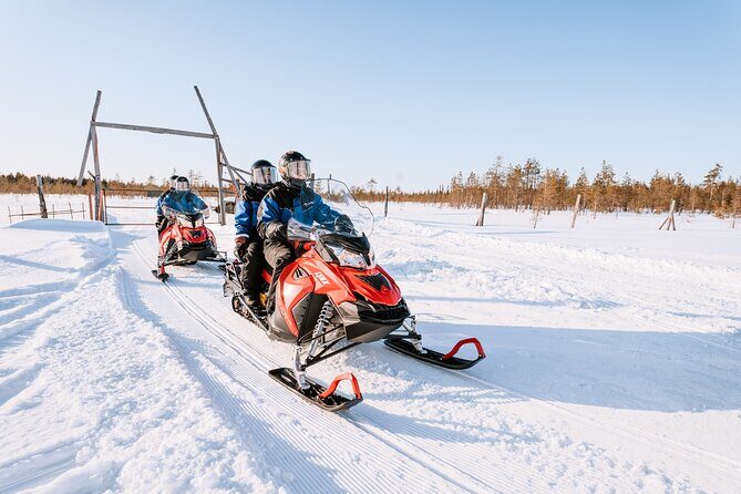 1 Hour Easy Snowmobile Safari in Levi - Stops for photos over frozen lakes and snowy forests