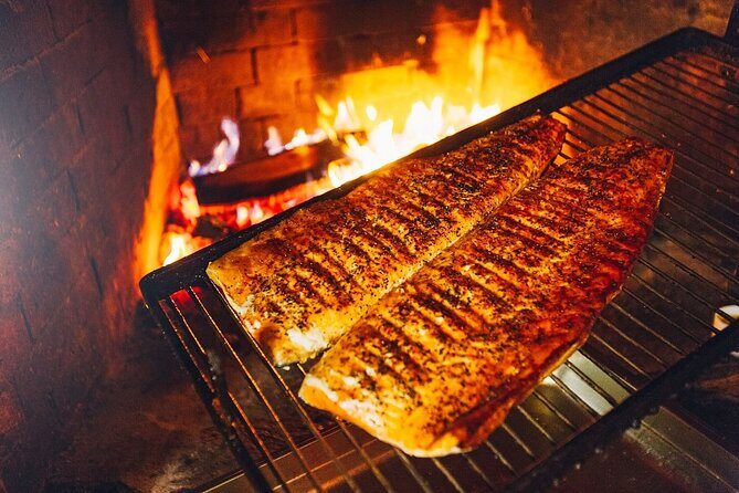 Arctic Day with Ice Fishing and Floating - Lappish BBQ with salmon: the meal that makes the cold part work