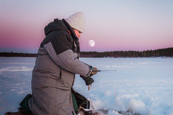 Authentic Reindeer Experience and Ice Fish with Lunch in the Wild - Ice Fishing on Winter Ice: Drilling a Hole and Waiting for the Bite