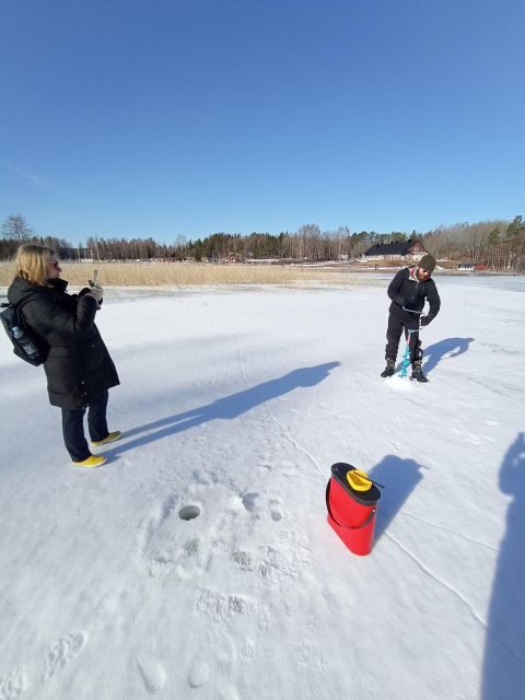 From Helsinki: Bodom Lake Ice Fishing with Food & Drinks - The Campfire in a Laavu: Makara, Glögi, and Cookies to Finish Warm
