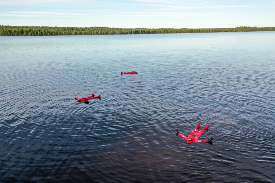 From Rovaniemi: Midnight Sun Forest Lake Float - The 2.5-hour flow: from hotel pickup to golden-hour float