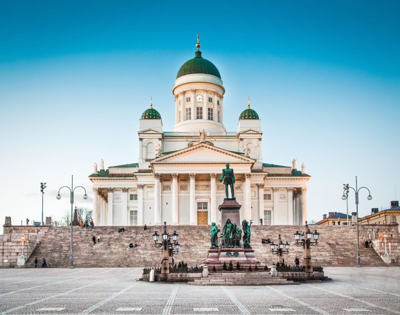 Helsinki: City Highlights and Suomenlinna Eco-Friendly Tour - Meeting Helsinki Central Station: statues, a sign, and 5 minutes to spare