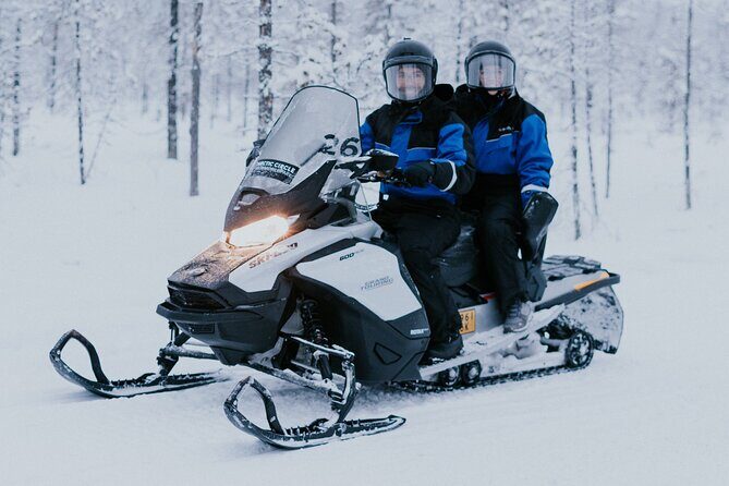 Ice Fishing by Snowmobile in Levi - Drilling the ice: the skill part most people actually remember