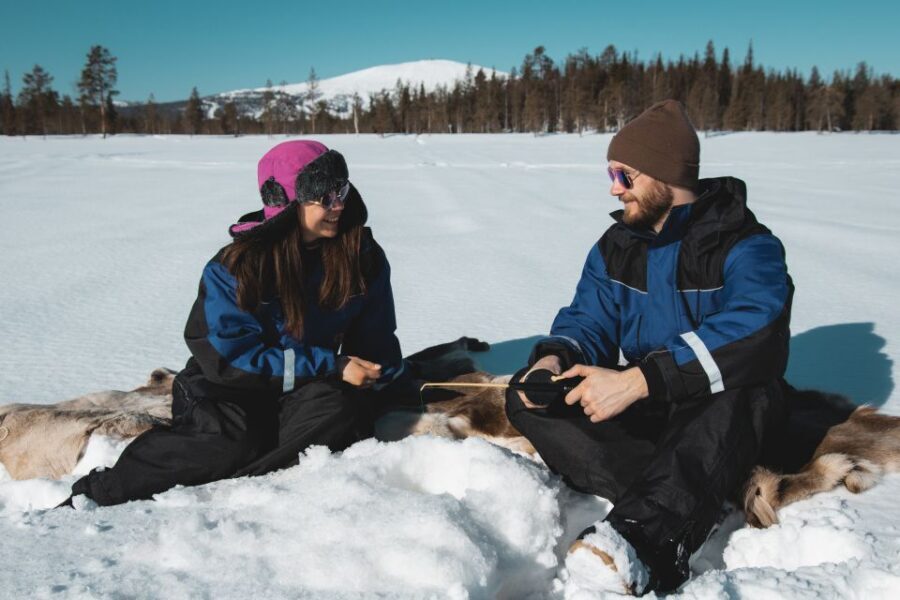 Levi: Finnish Ice Fishing Tour by Car - Warm car rides, silent forest pauses, and campfire breaks