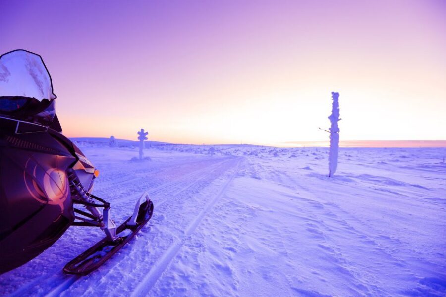 Levi: Snowmobile Tour to Snow Village - Getting set up: overalls, boots, and the driver requirement