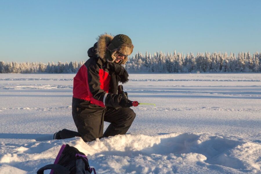 Ruka: Ice fishing trip - Walking onto the ice: snowshoes and drilling your first hole