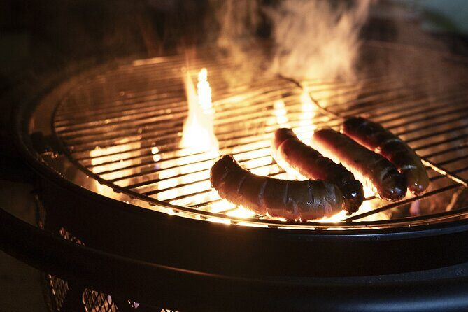Ski Trek to the Wilderness - Extra Small group - The kota break: fire-grilled snack, warm drinks, and reindeer skins